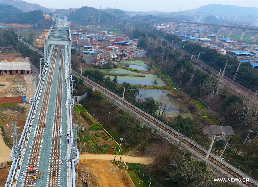 Workers adjust Wuhan-Jiujiang Passenger Railway in Jiangxi Workers adjust Wuhan-Jiujiang Passenger Railway in Jiujiang, east China's Jiangxi Province, Feb. 15, 2017.
