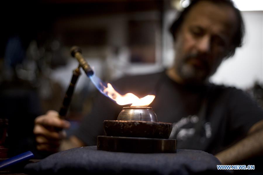 Craftsman makes mate tea sets in Buenos Aires, Argentina ARGENTINA-BUENOS AIRES-MATE TEA SET-MANUFACTURE
