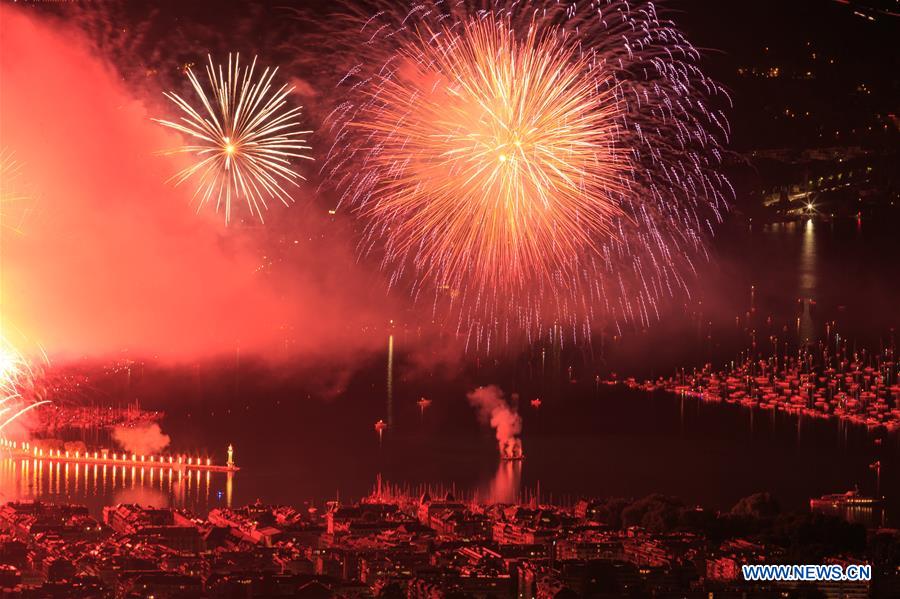 Fireworks illuminate sky over Leman Lake during Geneva Festival in Switzerland SWITZERLAND-GENEVA-FESTIVAL-FIREWORKS