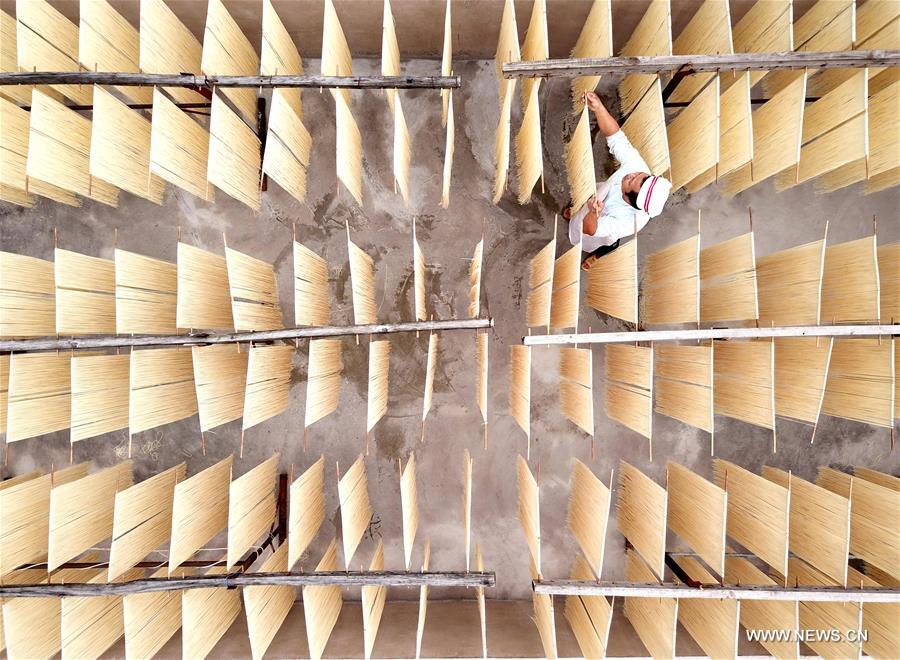 Worker dries noodles in Kaili, SW China CHINA-GUIZHOU-KAILI-NOODLE(CN)