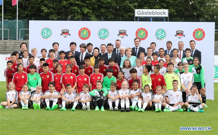 Xi, Merkel watch friendly football match between Chinese, German youth teams