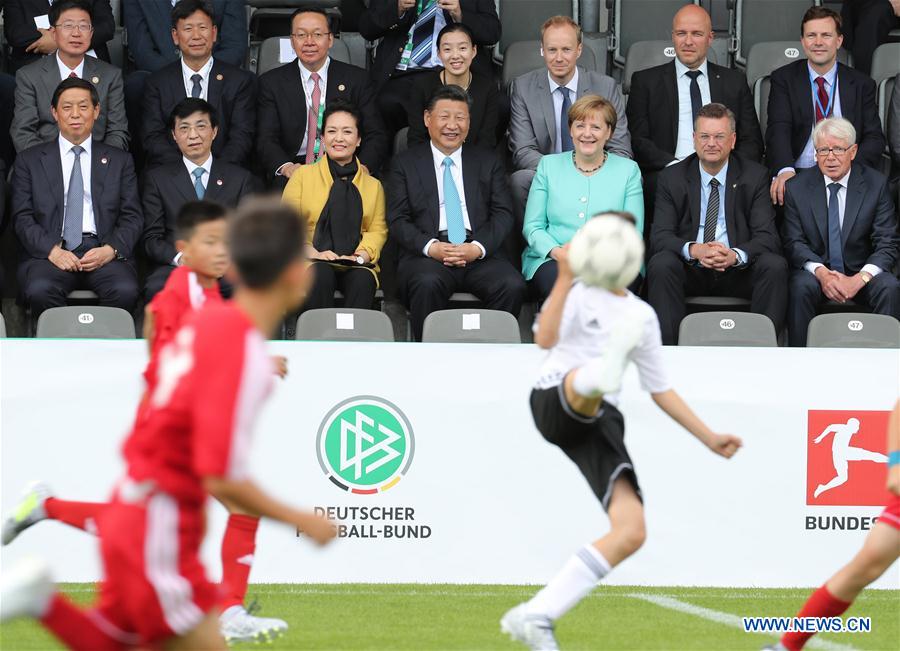 Xi, Merkel watch friendly football match between Chinese, German youth teams