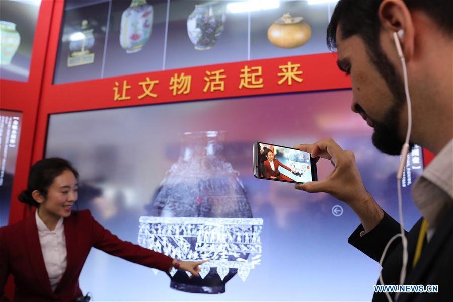 Foreign journalists visit exhibition on China's achievements