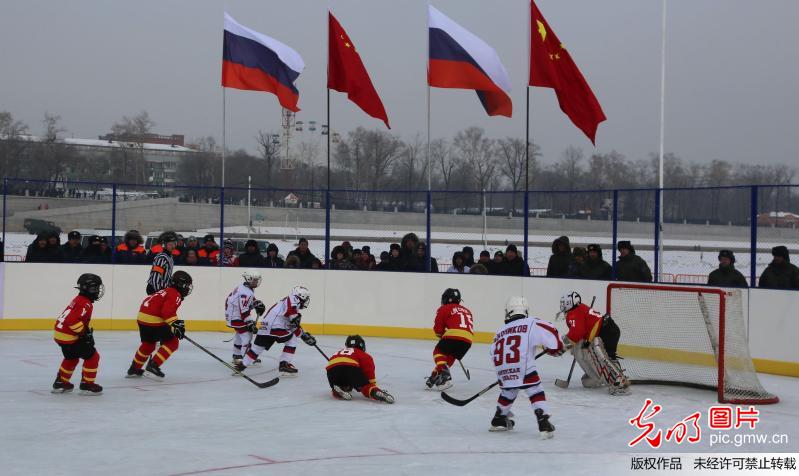 Hockey friendly match between Chinese and Russian young sportsmen held at border river