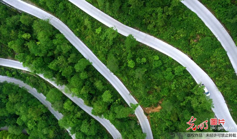 Aerial view of winding mountain road in C China’s Hubei