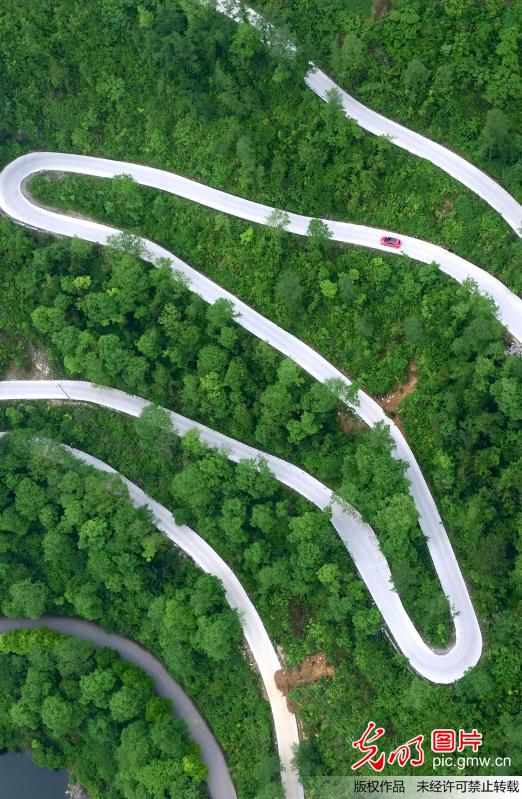 Aerial view of winding mountain road in C China’s Hubei