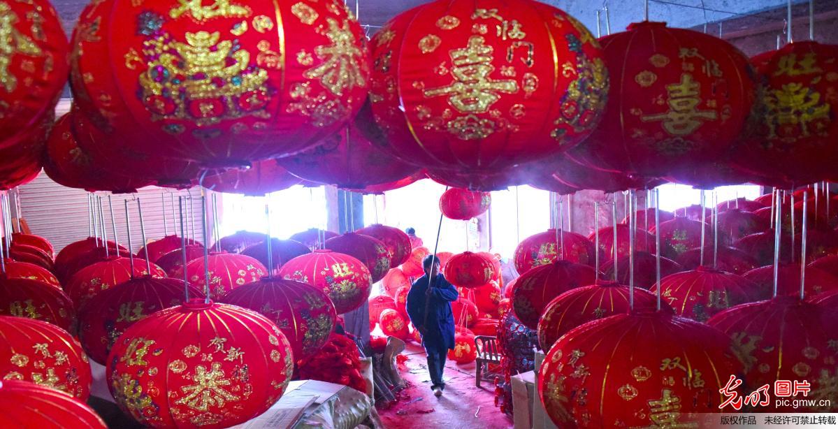 Villagers work in lantern workshop for upcoming Spring Festival in Zhejiang