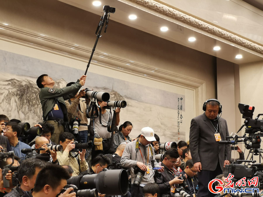 Journalists prepare for press conference for 2nd session of the 13th CPPCC National Committee