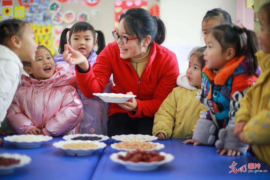 Kids learning to cook Laba Congee celebrating New Year