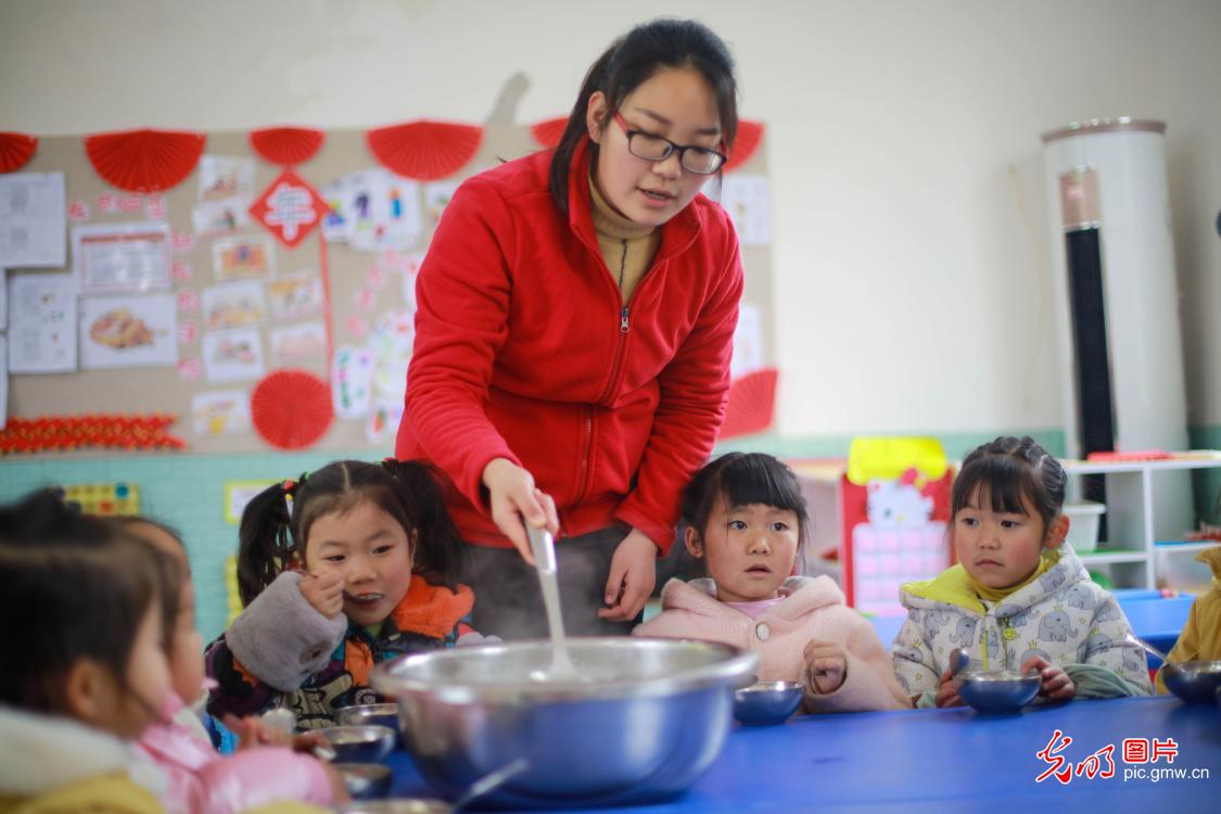 Kids learning to cook Laba Congee celebrating New Year