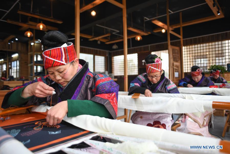 Local women make embroidery works in Shibing County, Guizhou