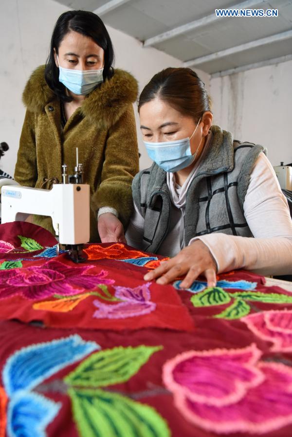 Kazakh embroidery production helps female villagers increase income in Xinjiang
