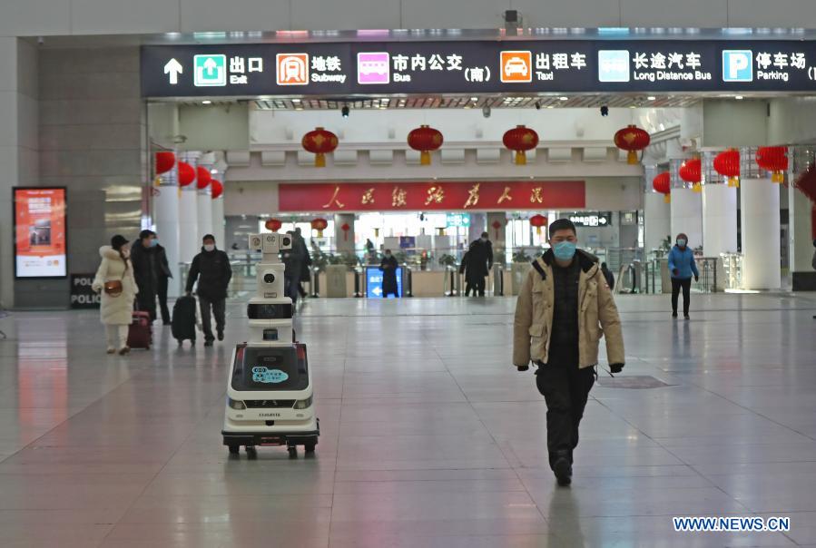 Disinfection, temperature-checking robot works at railway station in NE China