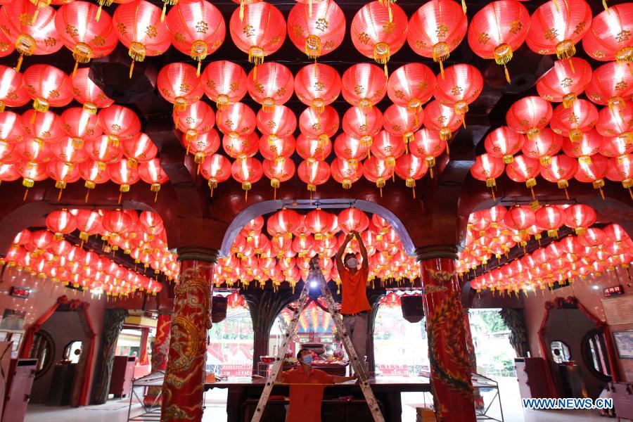 People install lanterns for upcoming Chinese New Year in Indonesia