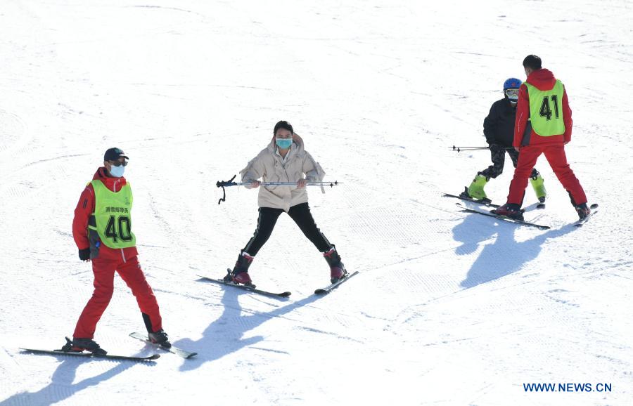 People practice skiing at ski resort in Shijiazhuang, N China