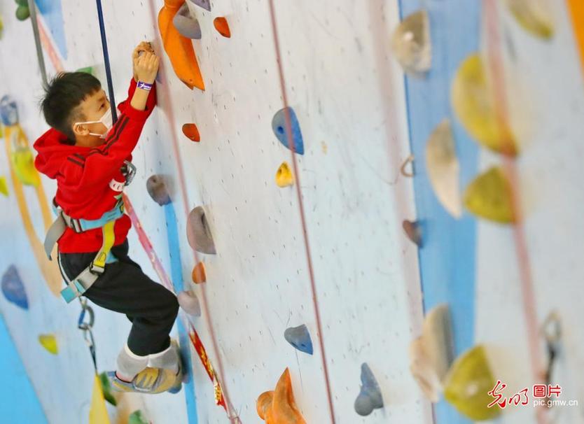 Children enjoy rock climbing in N China’s Hebei Province