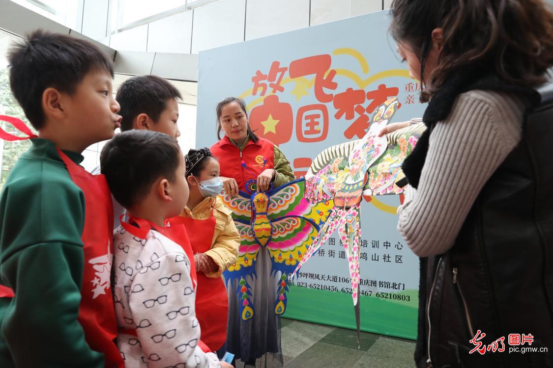 Kids making kites in C China's Chongqing