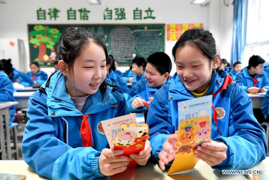 Students return to school for new semester in China