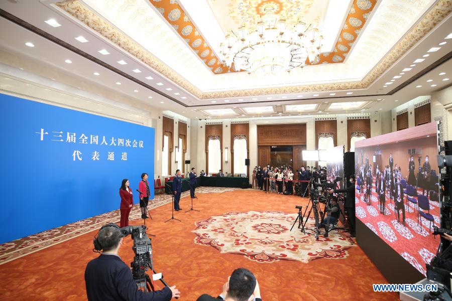 Deputies receive interview before opening meeting of fourth session of 13th NPC