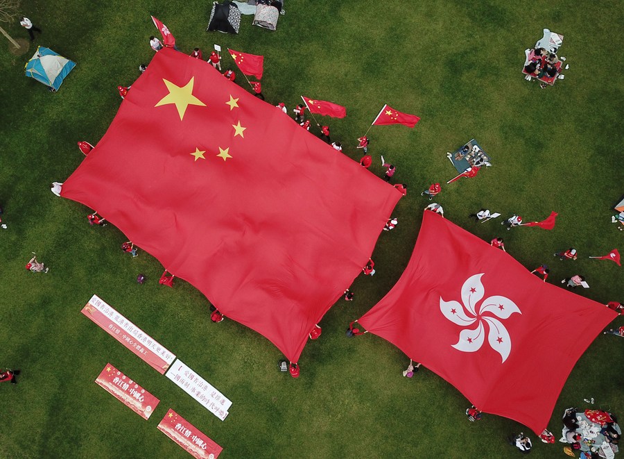 China adopts decision to improve Hong Kong electoral system