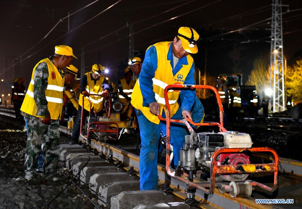 Staff members work at Huangtai Station of Qingdao-Jinan railway