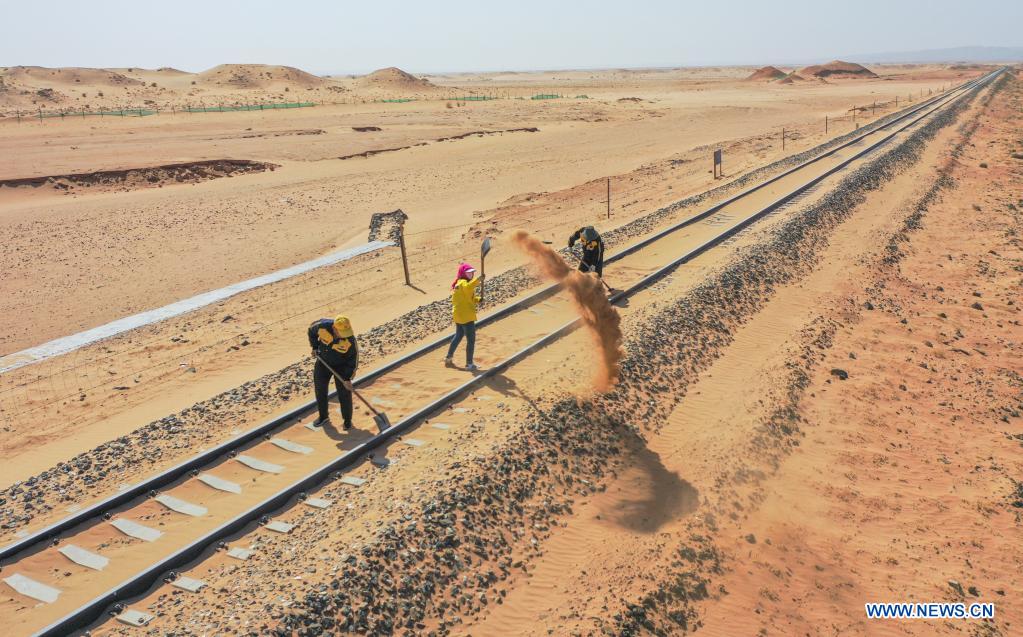 Workers stationed in China's Inner Mongolia for railway sand control
