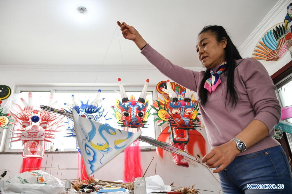 Kite-making master in Weifang City of east China's Shandong