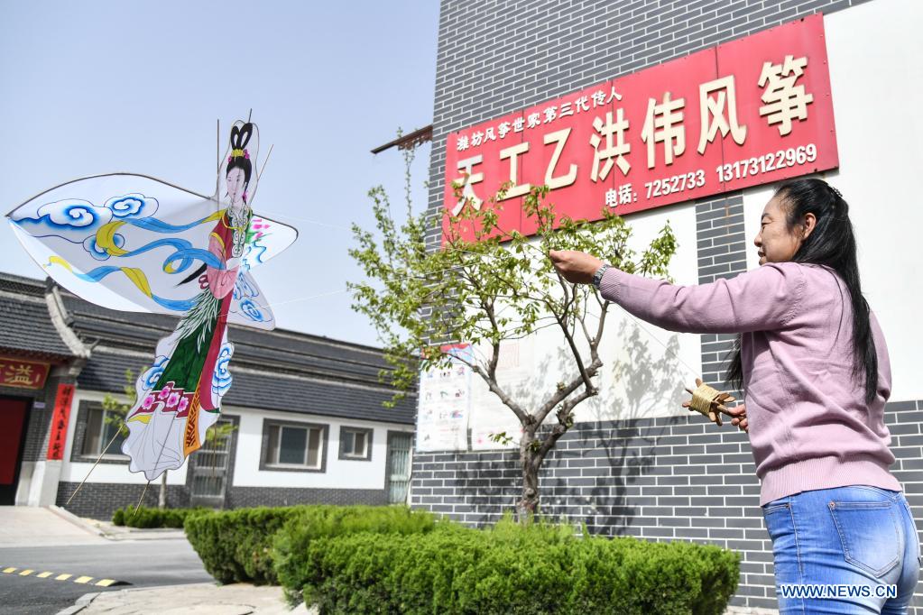 Kite-making master in Weifang City of east China's Shandong