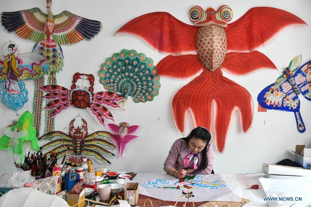 Kite-making master in Weifang City of east China's Shandong