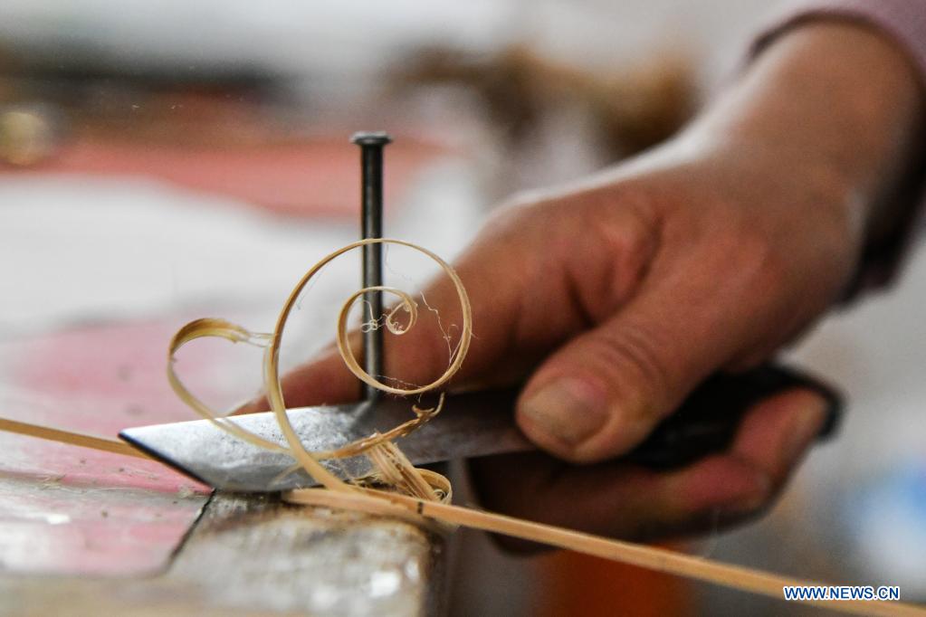 Kite-making master in Weifang City of east China's Shandong