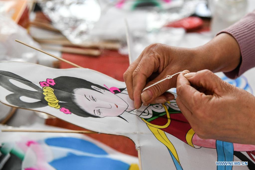 Kite-making master in Weifang City of east China's Shandong