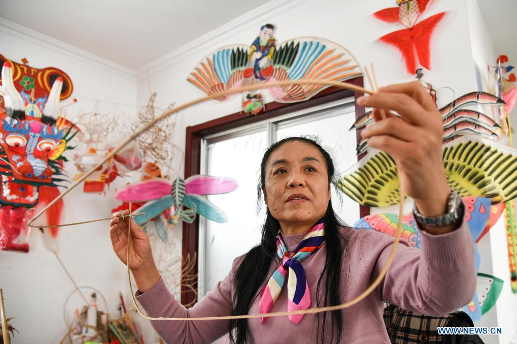 Kite-making master in Weifang City of east China's Shandong