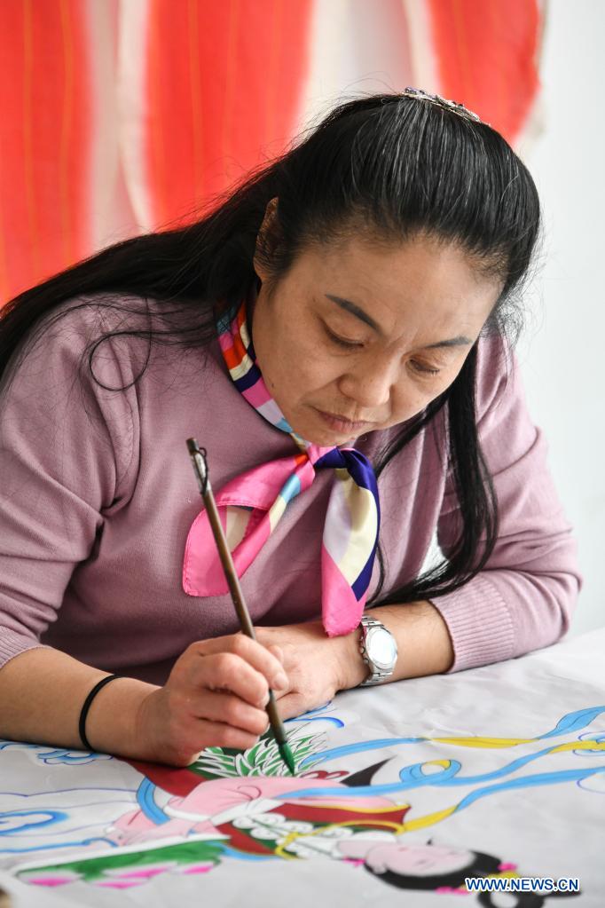 Kite-making master in Weifang City of east China's Shandong