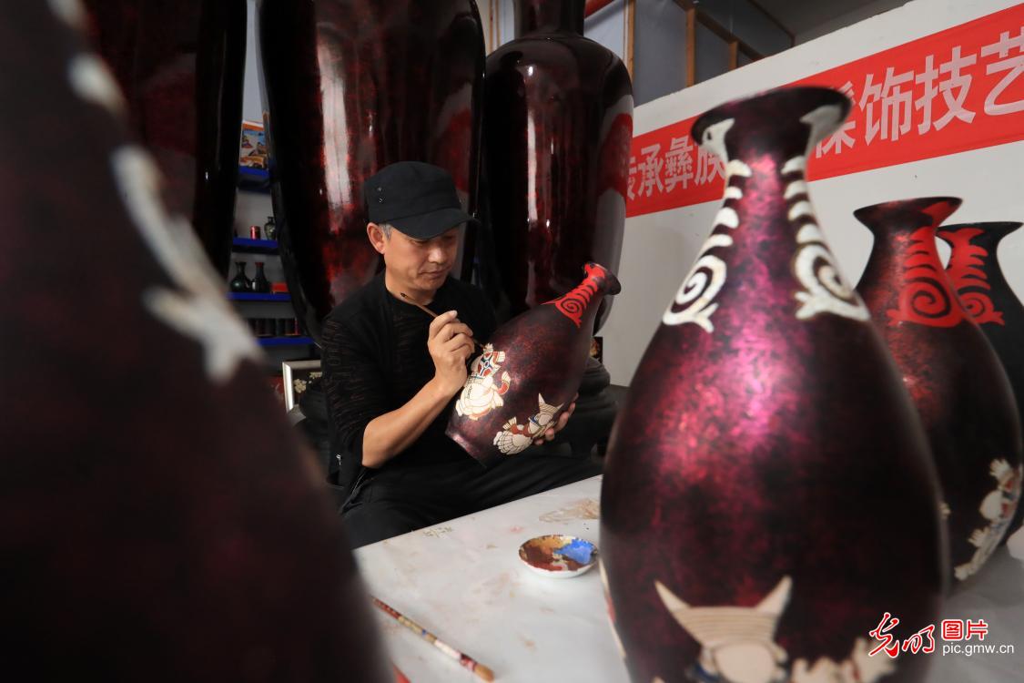 Intangible cultural heritage of Yi lacquerware decoration technique in SW China's Sichuan