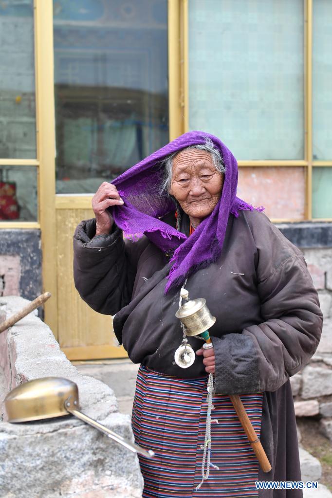 Former serf enjoys happy life after democratic reform in Tibet
