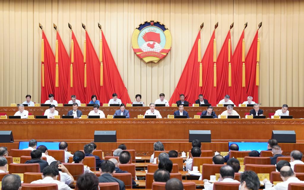 Top political advisor urges enhanced consultation on implementing five-year plan