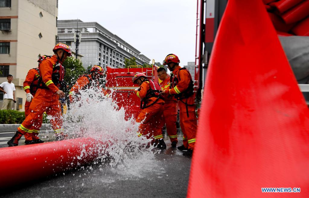 Rescue team of 1,800 firefighters deployed to flood-hit Henan from 7 neighboring provinces