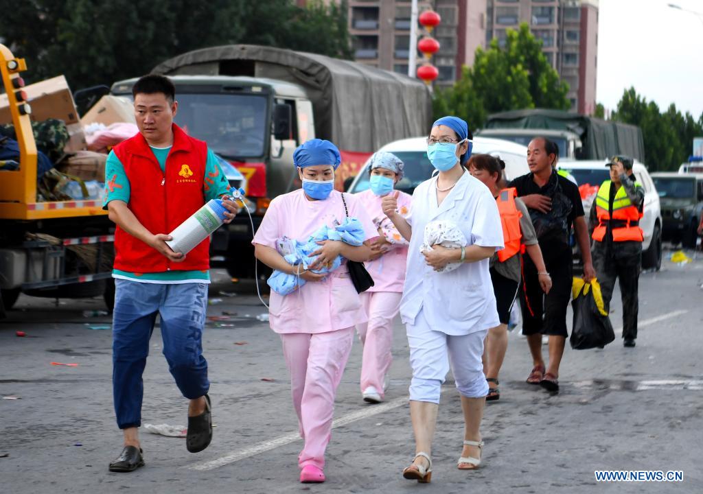 Patients of power-disrupted hospital transferred in China's rain-ravaged Henan