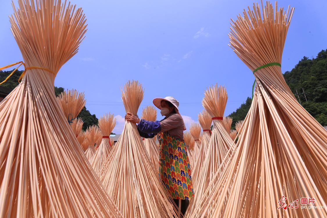 Workers processing bamboo products in E China's Jiangxi Province