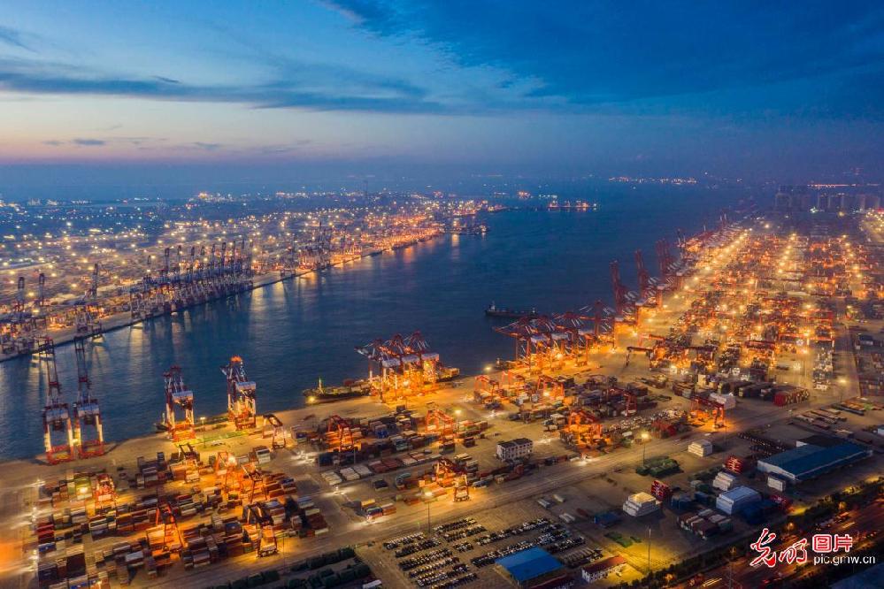 Brightly lit container terminal seen in E China's Qingdao