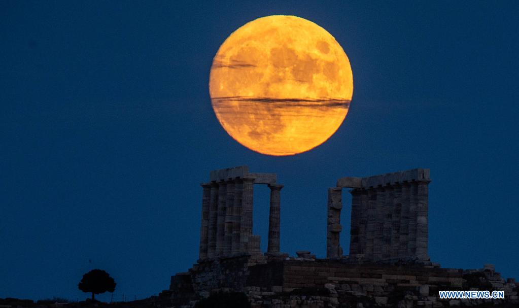 Full moon seen over Temple of Poseidon in Greece