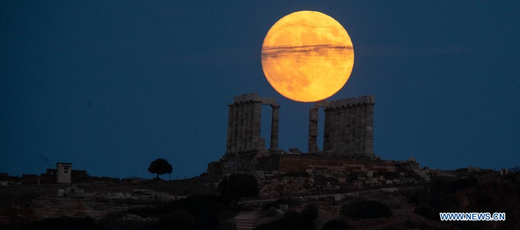 Full moon seen over Temple of Poseidon in Greece