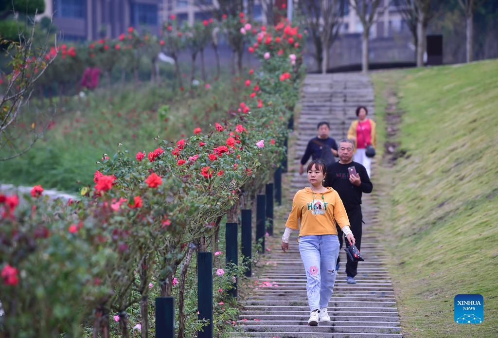 Residents spend leisure time in waterside walkway built in Yunyang district of Chongqing