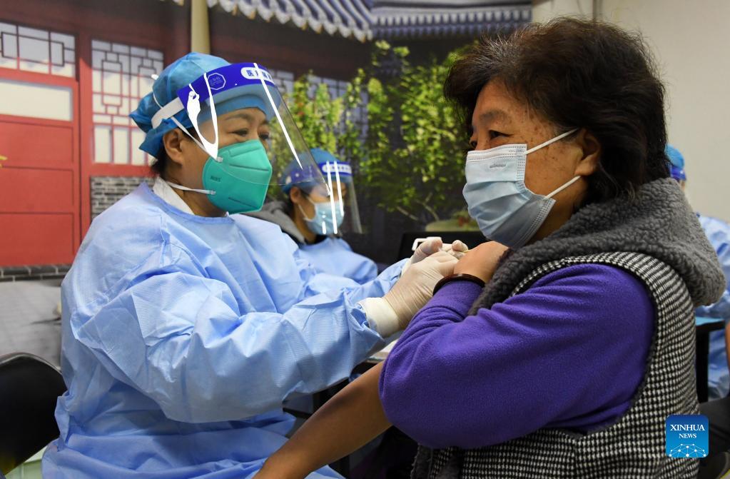 Local residents receive booster shot of COVID-19 vaccine in Beijing