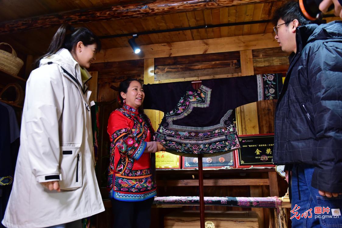 Wealth across stitches of Miao embroidery