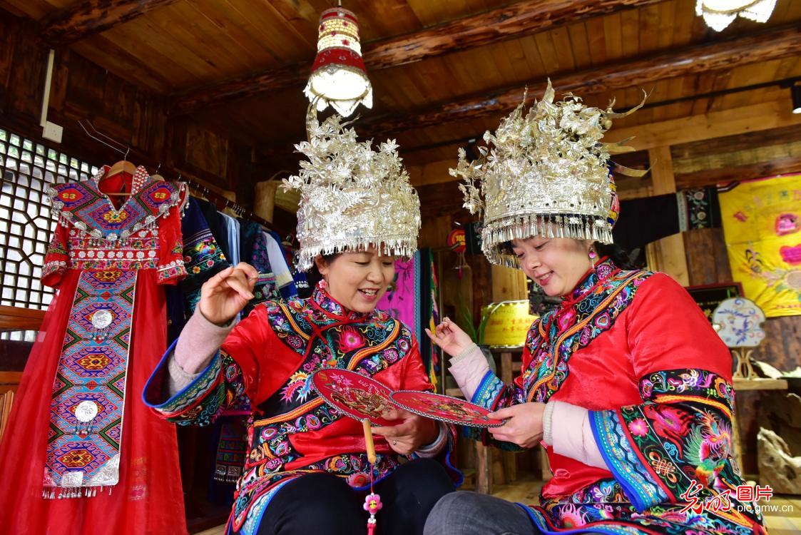 Wealth across stitches of Miao embroidery