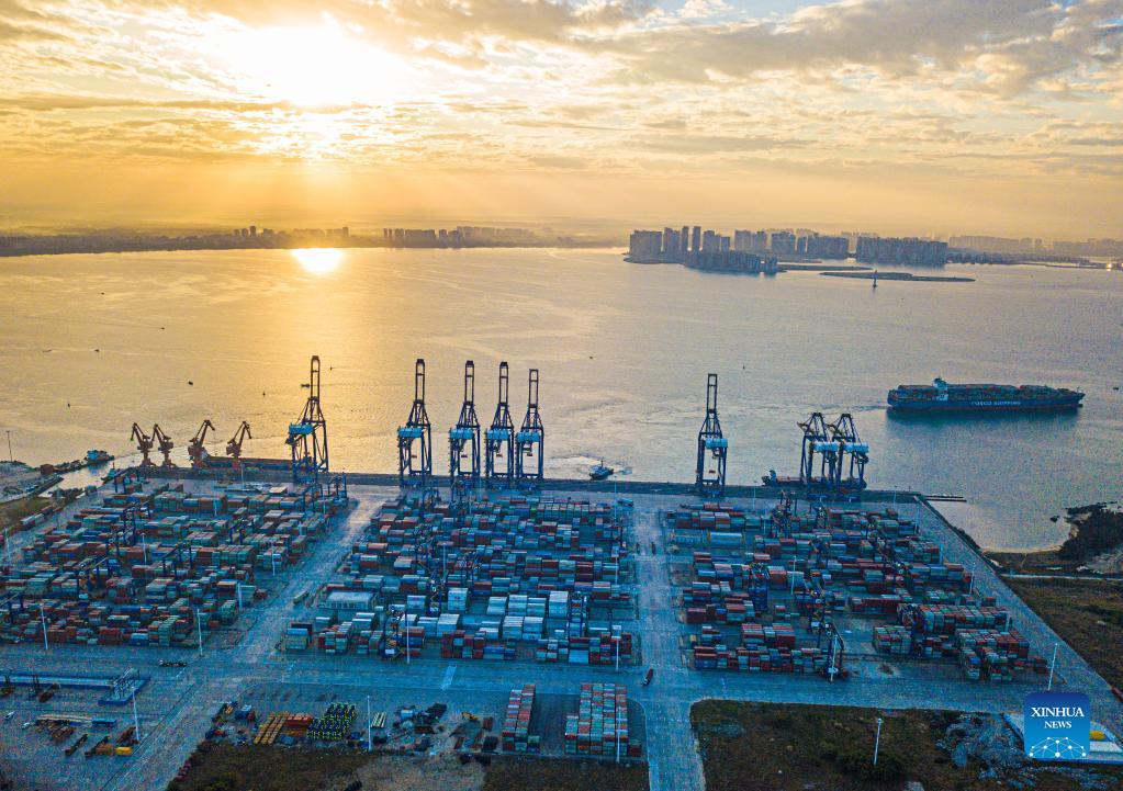 Sunrise scenery of Yangpu international container port in S China's Hainan