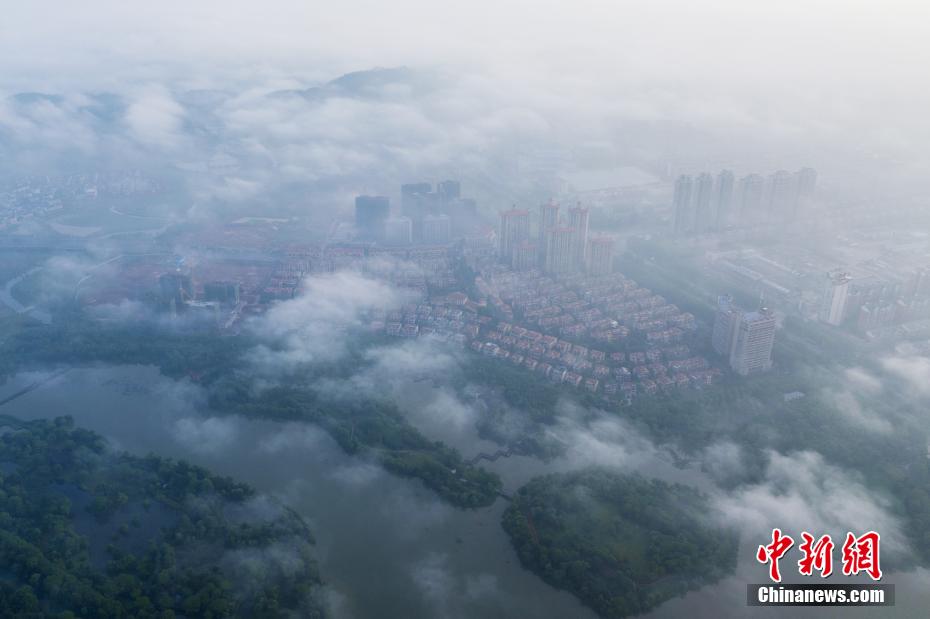 Aerial view of cloud-enveloped Xinyu in E China’s Jiangxi Province