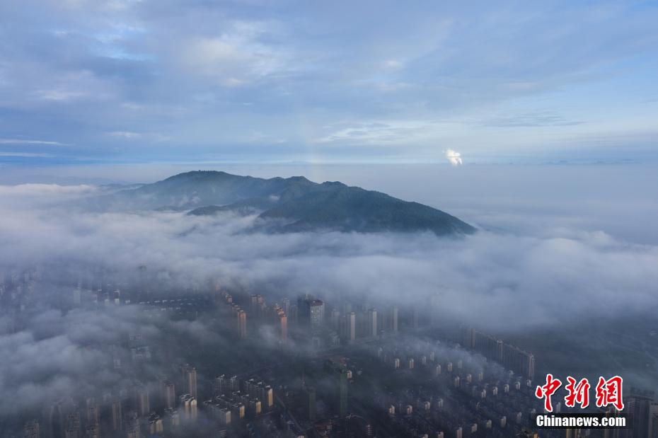 Aerial view of cloud-enveloped Xinyu in E China’s Jiangxi Province