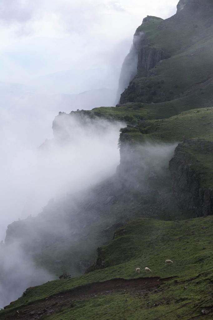 Scenery of Mount Longtou with clouds floating in SW China's Sichuan